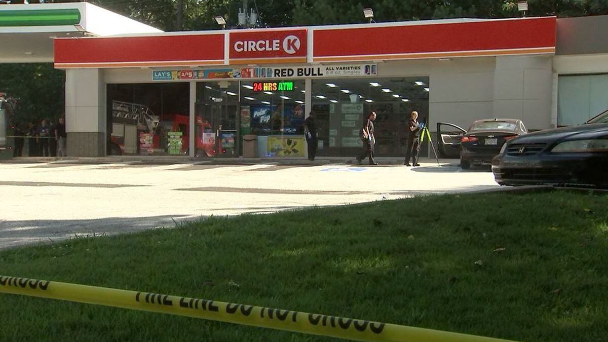 Man's body found in car at gas station, police say
